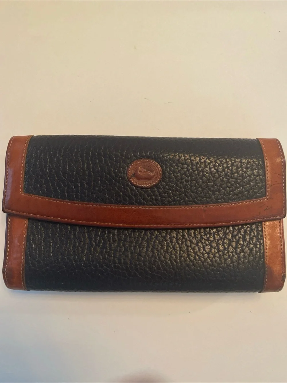 Dooney & Bourke Black Pebbled Leather Wallet with Brown Trim